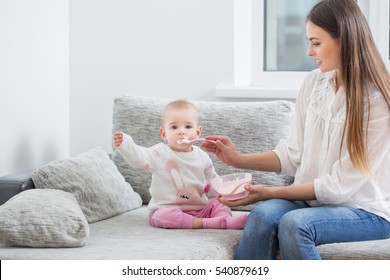 Mom Feeding Baby Indoor