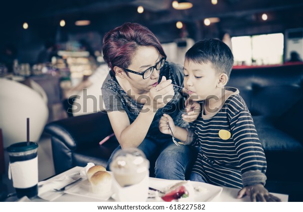 Mom Feeding Cake Son Cafe People Food And Drink Stock Image