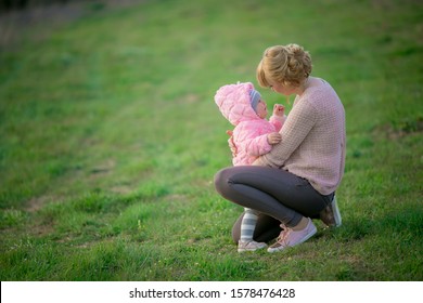 Mom Gently Hugs The Little Daughter And Soothes Her After Tears.