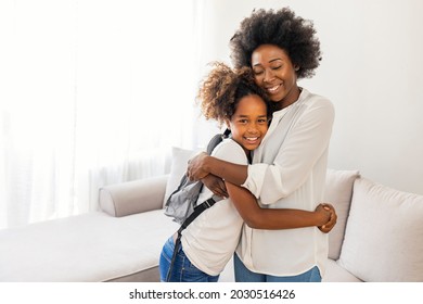 Mom Gets Daughter Ready For School In The Morning. Mother Preparing Her Daughter For First Day In School. Mother Leads Little Child School Girl In First Grade. Mother Preparing Her Child For School