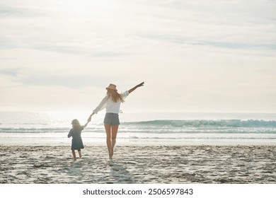 Mom, girl and back on beach with freedom on summer vacation, journey and seaside adventure for memories. Mother, female child and holding hands by ocean on holiday, together and bonding with love. - Powered by Shutterstock