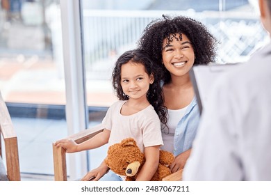 Mom, girl and happy in clinic with doctor for consultation or checkup with clipboard or document for information. Parent, daughter and medical at reception or waiting area for healthcare and wellness - Powered by Shutterstock