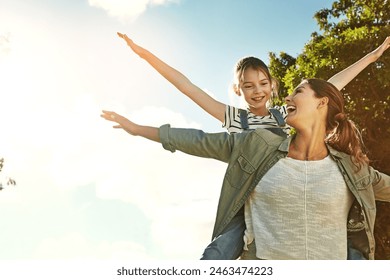 Mom, girl and piggyback for airplane in park for bonding, love and mock up space on holiday with memory. Family, mother and daughter with smile, connection and game for flight in garden on vacation - Powered by Shutterstock