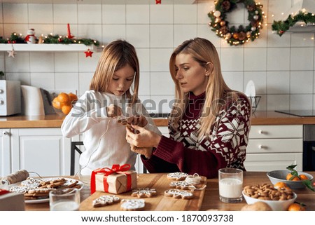 Similar – Image, Stock Photo Gingerbread girl cookie and little boy cookie. Christmas concept