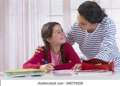 Mom Helping Her Daughter Do Homework