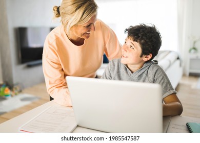 A Mom Helping Kid With Homework At Home