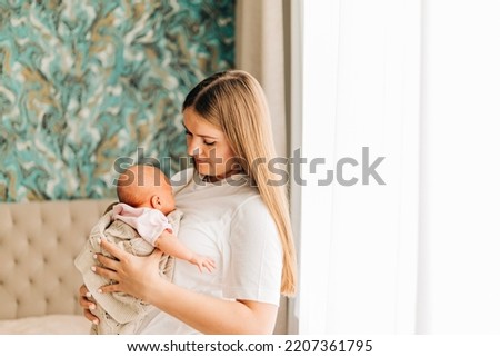 Similar – Image, Stock Photo Mother giving bottle to her newborn
