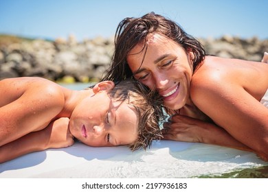 Mom With Her Teen Son Lying On A Swimming Board. Happy European Family Having Fun Floating On A Swim Board In The Sea On A Hot Summer Day