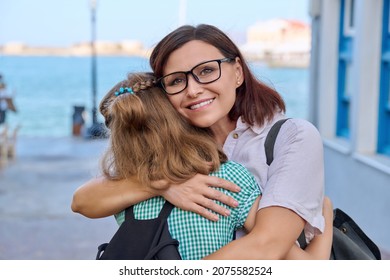 Mom Hugging Daughter Outdoors, Happy Mother's Face Close Up