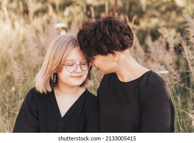 Mom Hugging Daughter Teenager On A Background Of Nature