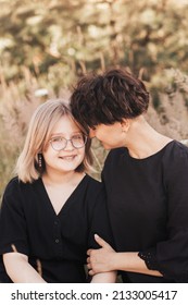 Mom Hugging Daughter Teenager On A Background Of Nature