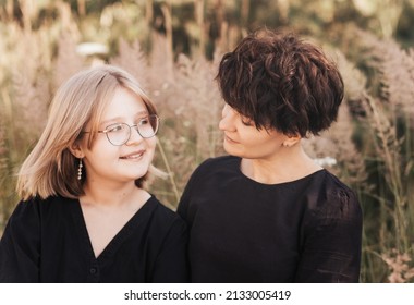 Mom Hugging Daughter Teenager On A Background Of Nature