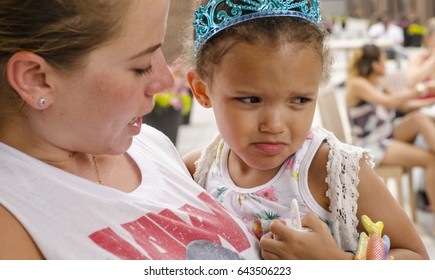 Mom Hugging Pouting And Crying Child 