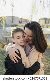 Mom Hugs Her Son In The Park After A Long Separation