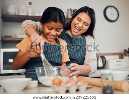 Mom, kid and baking in kitchen, family home and house for childhood fun, learning or development. Mother and daughter cooking, teaching and mixing ingredients in bowl to bake dessert, flour and whisk