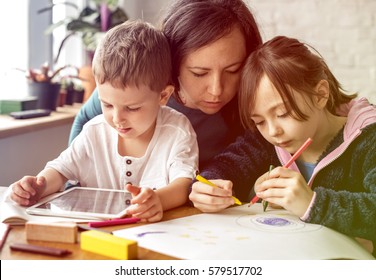 Mom and kids at homeschool learning together