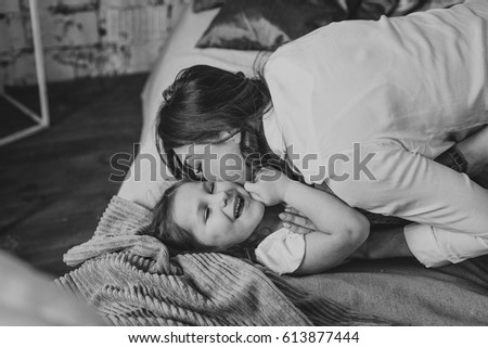 Similar – mother and child son sleeping together in bed