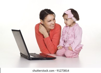 mom and little daughter with laptop on white
