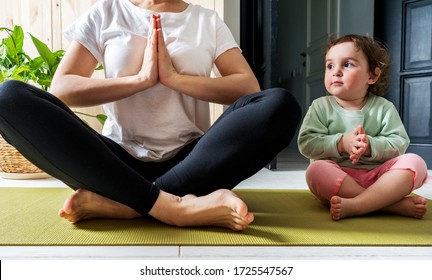 Mom And Little Daughter Spend Time Together For Yoga In Quarantine At Home. National Yoga Day. Healthy Living In Lockdown.