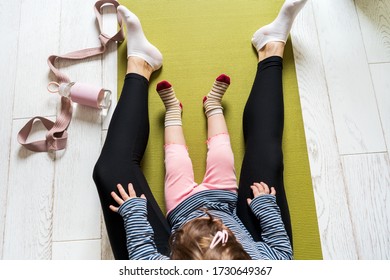 Mom And Little Daughter Spend Time Together For Yoga In Quarantine At Home. National Yoga Day. Healthy Living In Lockdown.