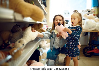 Mom And Little Girl Choosing Soft Toys, Kid's Shop