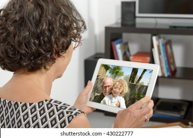 Mom Making A Distant Call On Internet With Her Family