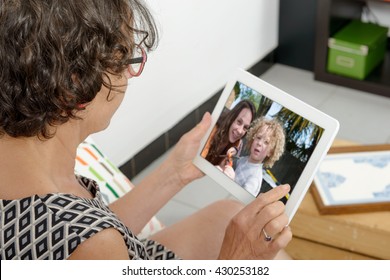 Mom Making A Distant Call On Internet With Her Family