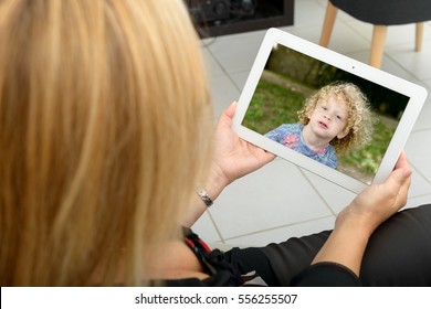 Mom Making A Distant Call On Internet With Her Family