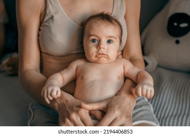 Mom, Mummy, Young Mother With Little Baby Daughter. Mum Kissing And Hugging Child. Newborn Cute Happy Girl Smiling In Woman Hands. Happiness For Parents In Family. Aged Parents, Parenting, Motherhood.