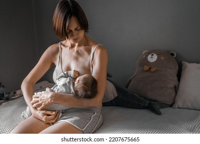 Mom, Mummy, Young Mother With Little Baby Daughter. Breast-feeding. Mum Feeding Child With Breast Milk.Newborn Cute Happy Girl Smiling In Woman Hands.Family Happiness.Age Parents,parenting,motherhood.