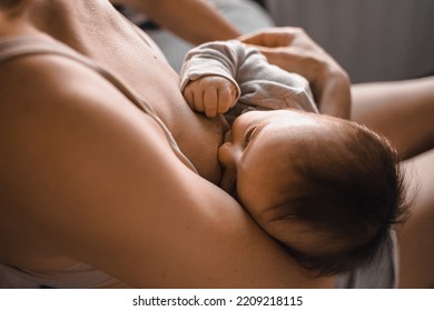 Mom, Mummy, Young Mother With Little Baby Daughter. Breast-feeding. Mum Feeding Child With Breast Milk.Newborn Cute Happy Girl Smiling In Woman Hands.Family Happiness.Age Parents,parenting,motherhood.