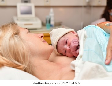 Mom And Newborn Baby Skin To The Skin After Birth In The Hospital