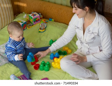 Mom playing with little son