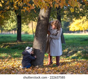 Mom plays with her little son in the park