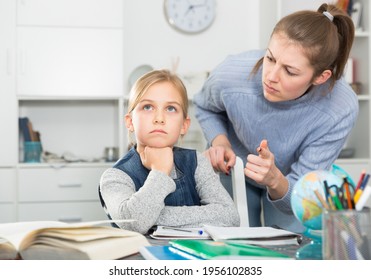 Mom Scolds Little Daughter For Poor Grades In School. High Quality Photo