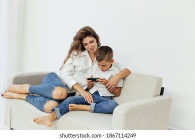 Mom Son Play Smartphone Games On Stock Photo 1867114249 Shutterstock pic pic
