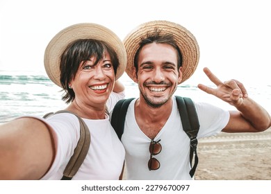Mom and son taking selfie outside - Happy family celebrating mother's day together - Powered by Shutterstock