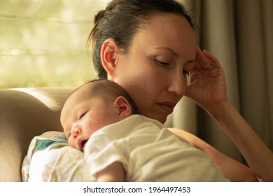A mom suffering from postpartum depression. Parenthood.