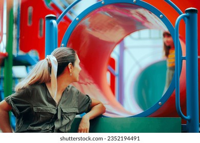 
Mom Supervising her Daughter at the Playground Slide. Positive parent encouraging her child to explore and have fun
 - Powered by Shutterstock