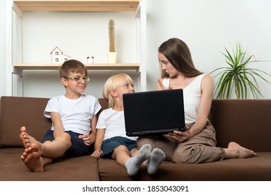 Mom Teaches Two Sons The Rules For Using Internet Resources. Computer Security.