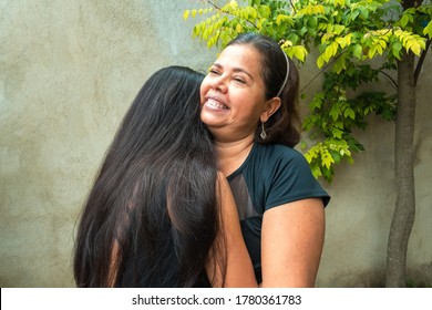 Mom With Teen Daughter Receiving A Hug