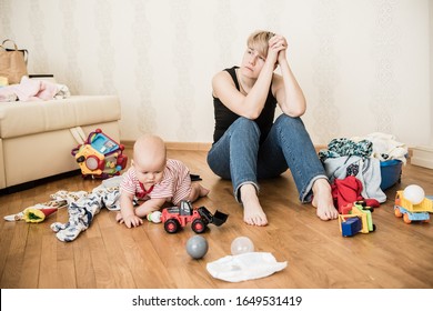 Mom Tired To Tidy Up The House. Child Scattered Toys. Children's Room. Mess In The House