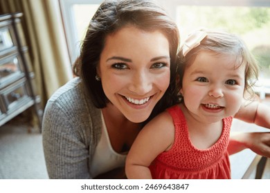 Mom, toddler and girl with selfie in house for memory with care, love and connection with photography. Profile picture, mother and daughter with bonding in portrait, relax and happy in family home - Powered by Shutterstock