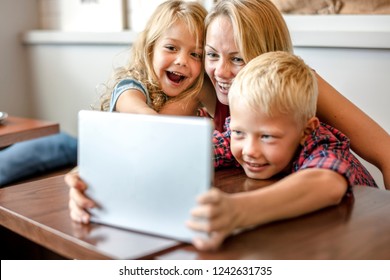 Mom Watching An Online Video With Her Kids