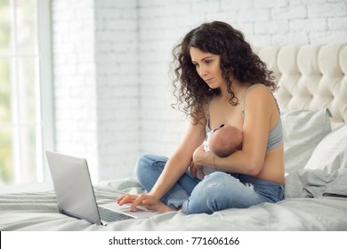 Mom works at home with a newborn. - Powered by Shutterstock