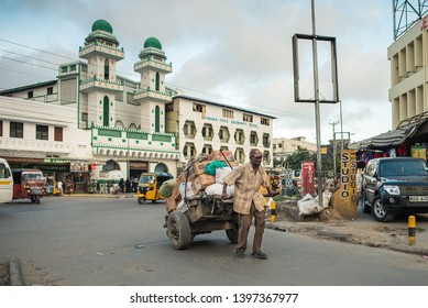 Mombasa / Kenya - December 5, 2019: A Man Pulls A Cart On A Street In Mombasa