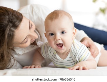 Mommy loving her child. Mother communicates with newborn baby.