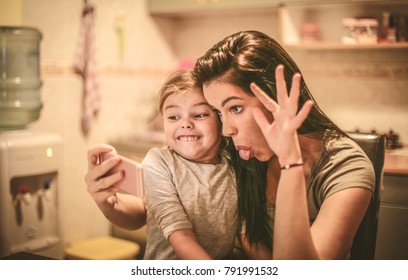 Mommy And Me Take A Self Portrait With Funny Face. 