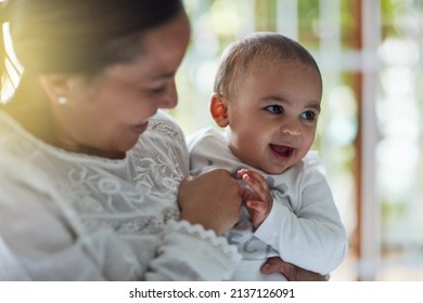 Mommys Lil Love Bug. Shot Of An Adorable Baby Boy Bonding With His Mother At Home.