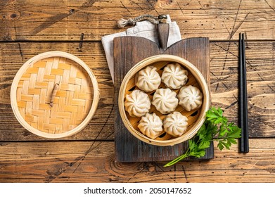 Momo Dumplings In A Bamboo Steamer. Wooden Background. Top View